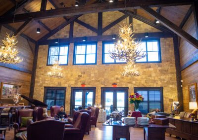 Lodge with dining tables and decorative chandeliers