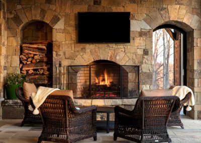 Chairs in front of fire place